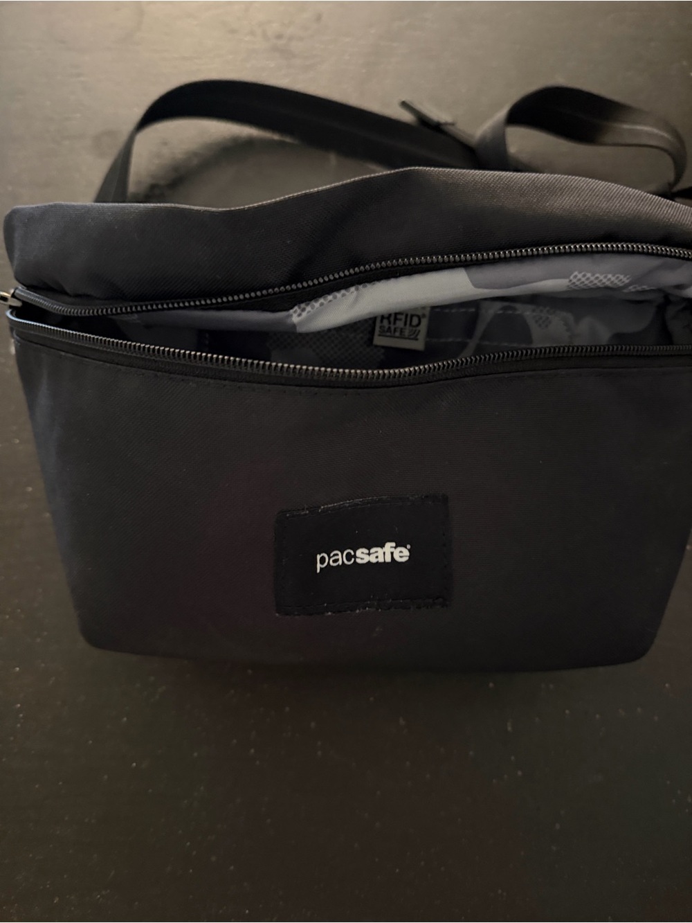 Pacsafe Black Crossbody Travel Bag with Gray Camouflage Lining